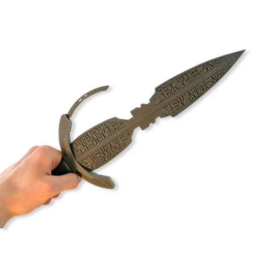 A 3D printed replica of the 'Blade of Ochi' from a popular sci-fi franchise, featuring a black color and a half-moon shaped view finder.